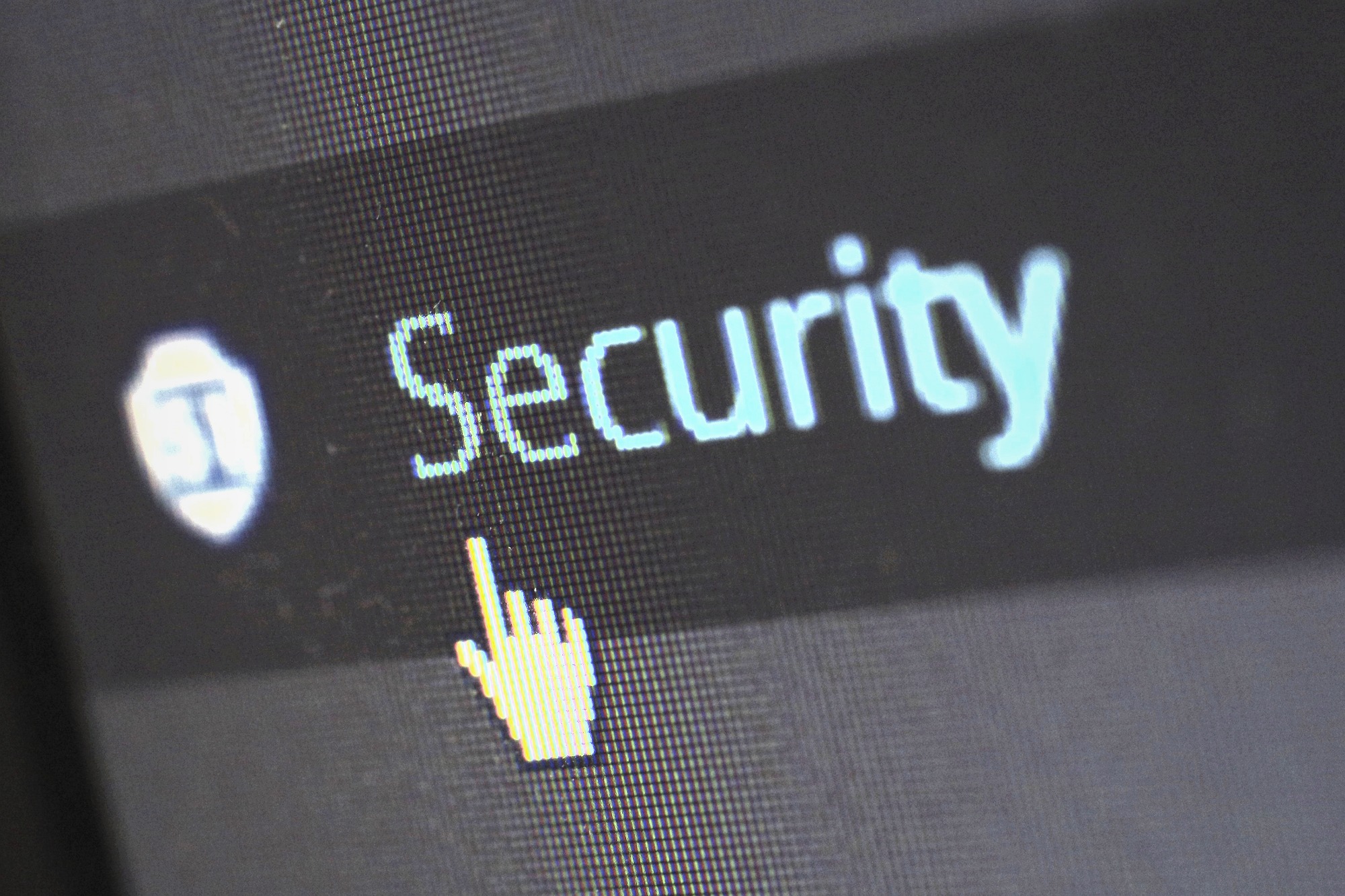 Close de tela exibindo a palavra Security com cursor em formato de mão — programa de cibersegurança para rede hospitalar regional pela Vale IT Solutions.